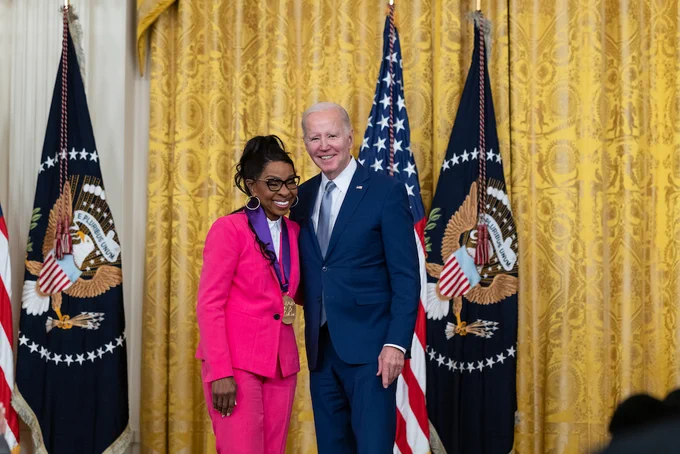 Gladys Knight smiles with President Biden after receiving her National Medal of Arts