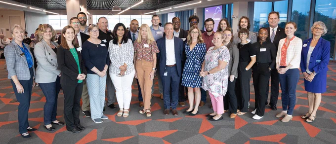 Members of the EV Readiness Program second cohort, the Metropolitan Mayors Caucus, and ComEd pose for a picture at the Caucus/ComEd second cohort kickoff on Aug. 9, 2023. | Photo courtesy of ComEd