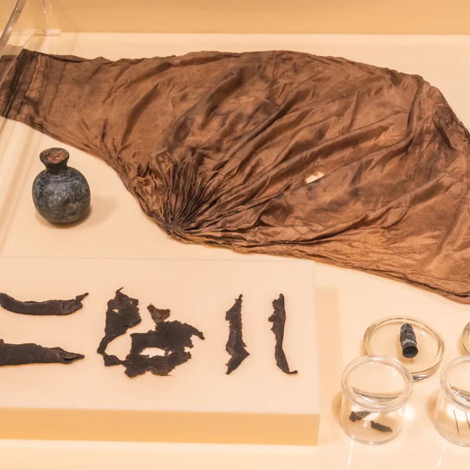 A silk hood on display in the exhibition.