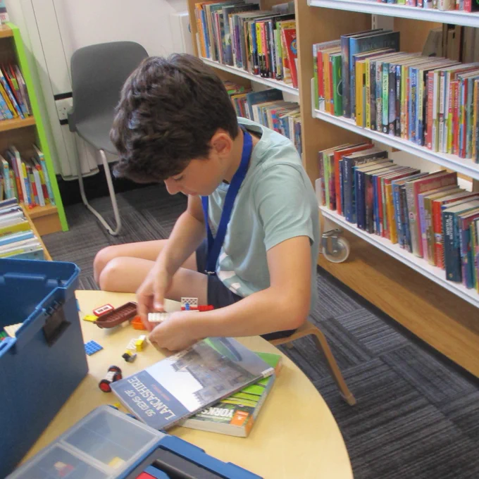 boy building with lego