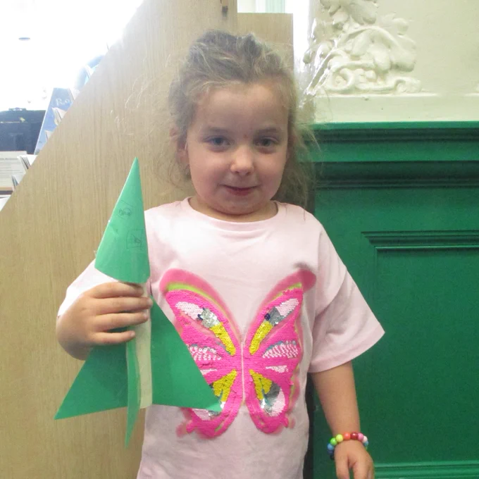 girl with cardboard rocket