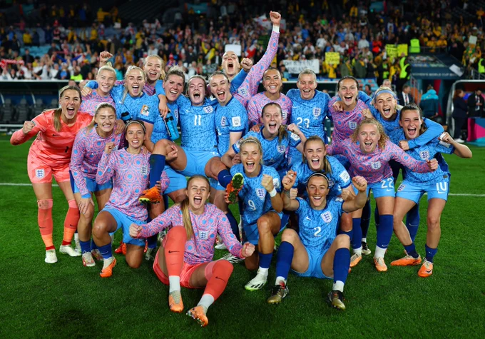 England's players celebrate with a group photo after the game.