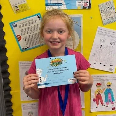 girl holding certificate