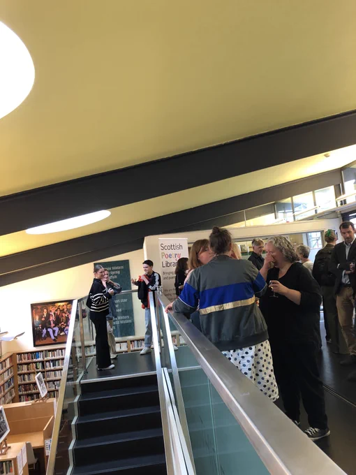 Decorative image: a mingling crowd of people in the Scottish poetry library