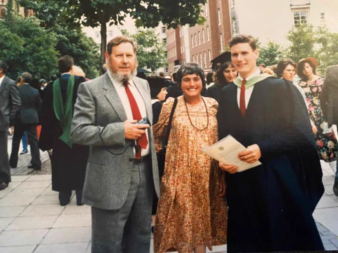A photograph of Keir Starmer with his parents at his university graduation ceremony. He is wearing a graduation cap and gown.