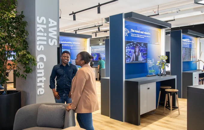 Two people talking at the AWS Skills Center in Cape Town, South Africa.