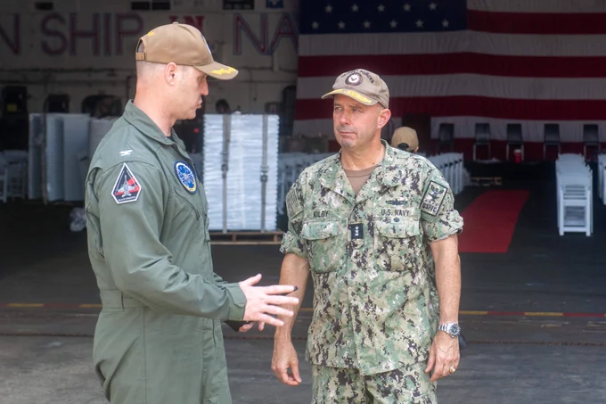 Capt. Colin Price, left, commanding officer, USS Dwight D. Eisenhower, greets Vice Adm. Jim Kilby, commander, Task Force 80 and deputy commander, U.S. Fleet Forces Command.