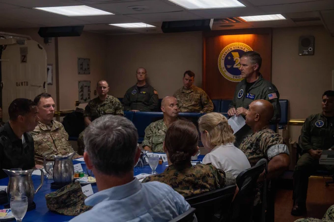 Vice Adm. Jim Kilby, commander, Task Force 80 and deputy commander, U.S. Fleet Forces Command, left, and Rear Adm. Marc Miguez, commander, Carrier Strike Group Two, brief distinguished visitors.