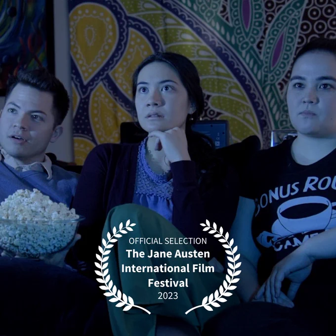 The festival laurels overlaid on a pic of lou, Henrietta, and Charlie