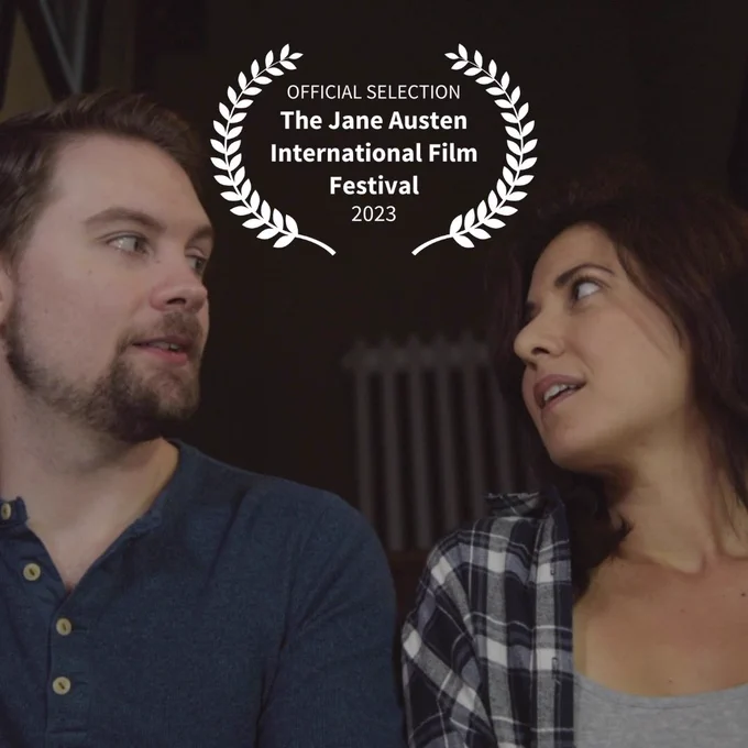 The festival laurels overlaid on a pic of fred and Ana