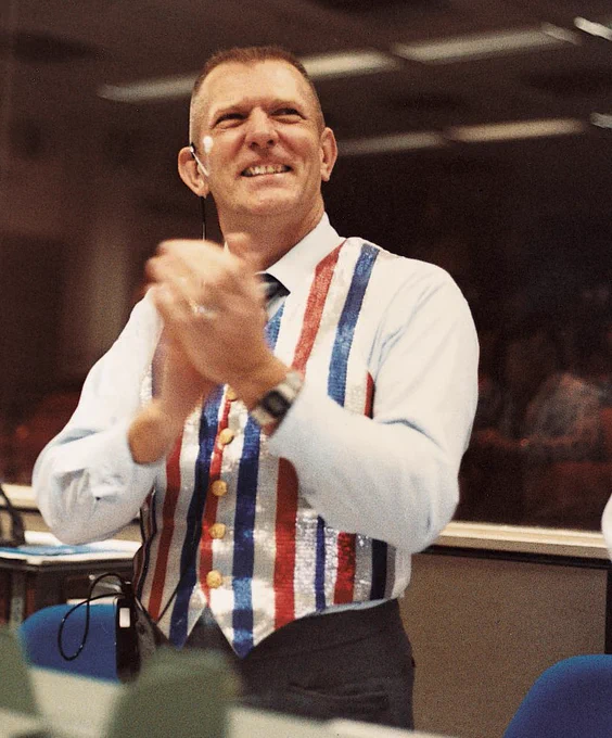 NASA flight director Eugene “Gene” Kranz is wearing a special red, white, and blue striped vest during shuttle mission STS-41C. 