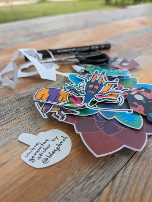 colorful stickers and a scissor. stacker on the backside reads 'unique generative sticker by bleeptrack'