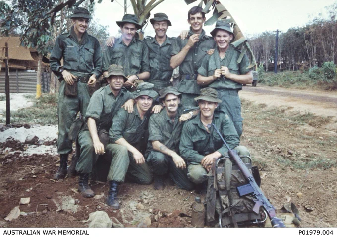 Vietnam. c.1968-01. Informal group portrait of members of Assault Pioneer Platoon, Support Company, 7th Battalion, The Royal Australian Regiment (7RAR), at the battalion lines, about to leave on Operation Coburg. Left to right: back row: Private (Pte) Peter Budworth, Pte `Canvas' Back, Corporal Trent Grall, Pte ?, Pte Paul Zigmund Trzecinski (killed in action); front row: Pte Les Deeble, Pte Steve Bowles, Pte Johnson, Pte ?. P01979.004