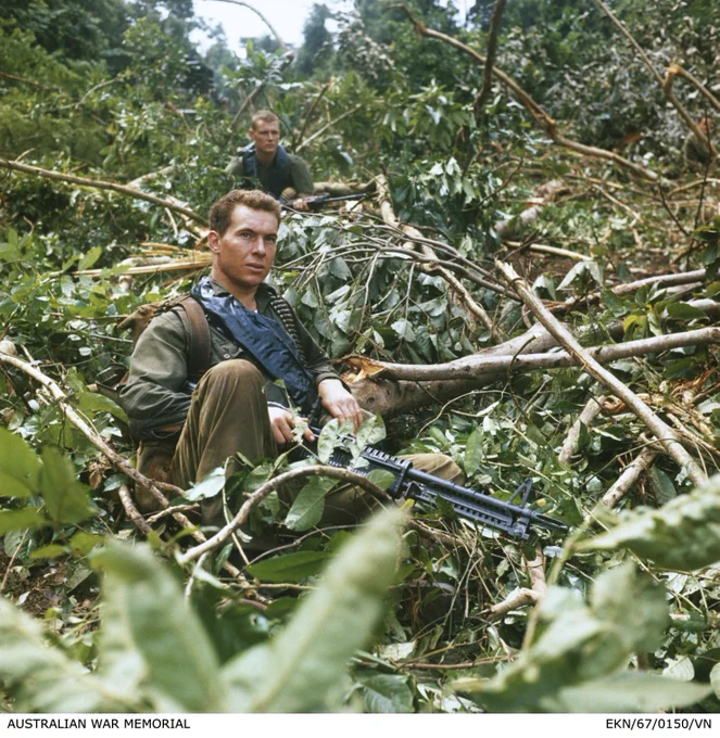 South Vietnam. c. 23 November 1967. Private Keith Craven, an M60 machine gunner with Fire Assault Platoon, Support Company, 7th Battalion, The Royal Australian Regiment (7RAR), pauses momentarily in the jungle during Operation Forrest. EKN/67/0150/VN