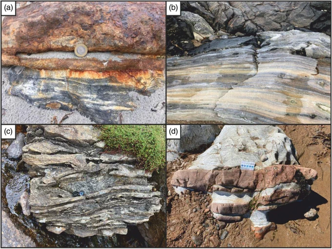 Outcrops of Paleoproterozoic marbles, NW Scotland. (a) Marble layered with dark graphitic matter, below ironstone, Gott, Tiree. (b) Marble layered with silicate porphyroblasts and quartzite laminae, Bay Steinigie, South Harris (field width 1 m). (c) Lens of marble (with lens for scale) within bedded quartzites, Armadale. (d) Marble intruded by pegmatites (brown, horizontal), Rosemarkie.