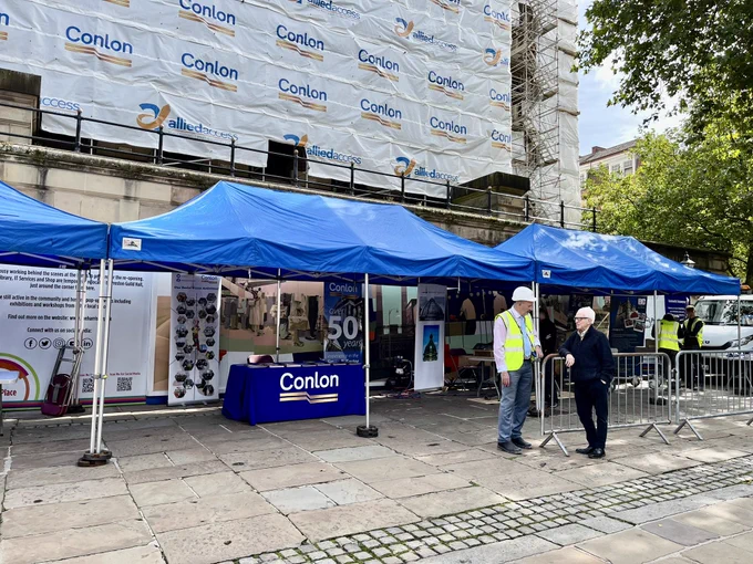 Blue gazebos on flag market