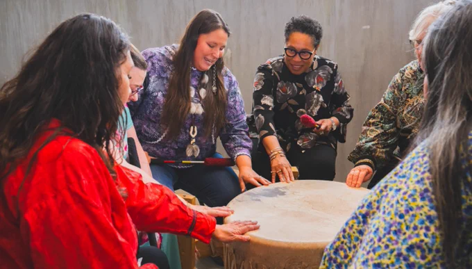 Secretary Marcia L. Fudge participating in a Kenaitze drum circle.