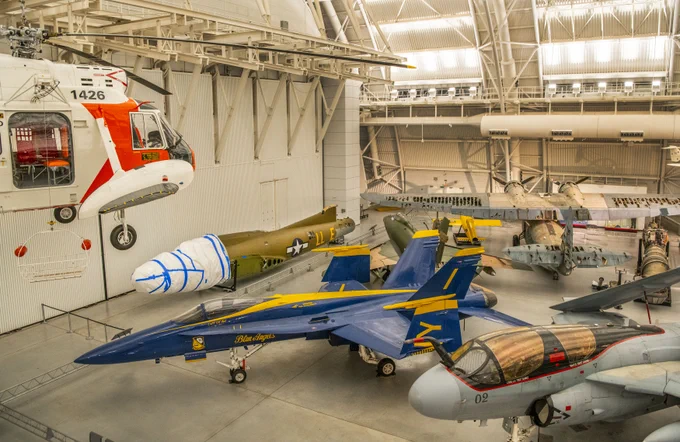 B-17 bomber with its nose wrapped in a covering on temporary display amongst other artifacts at the Steven F. Udvar-Hazy Center