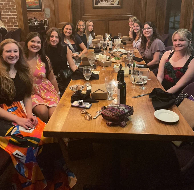 Picture of 10 lab members at a restaurant dinner table.