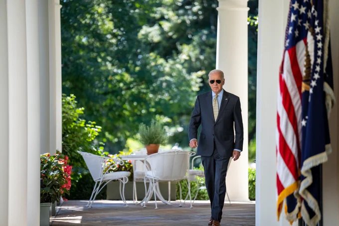 President Biden walks to deliver remarks on August job growth.