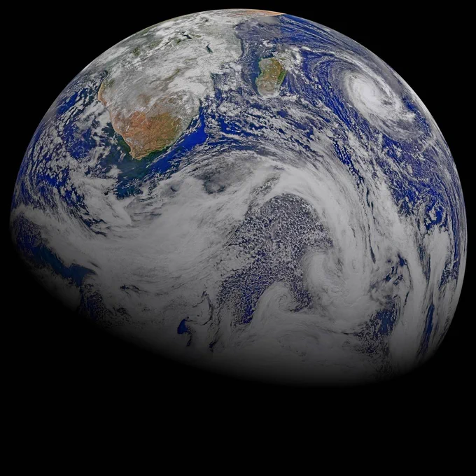 Clouds swirl through much of this composite image of southern Africa and the surrounding oceans. The continent can be seen at the top part of the globe, while the bottom left fades into the darkness of space. Credit: NASA, NOAA