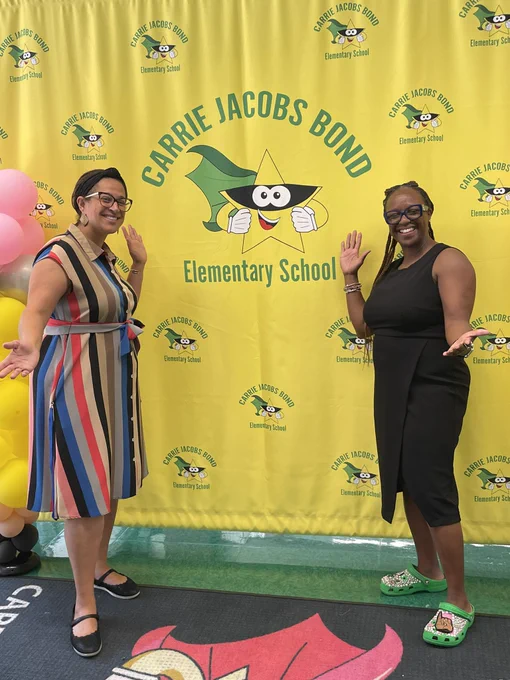 Me and Dr. Wright with Carrie Jacobs Bond yellow picture back drop