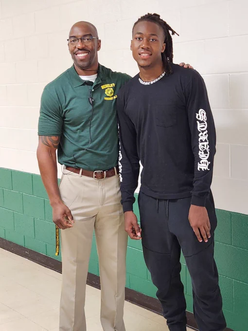Ayo Dosumnu of the Chicago Bulls pictured with Principal Rader on the first day of school.