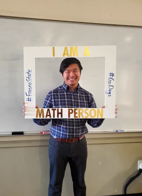 A picture of me with a frame that says "I am a math person"