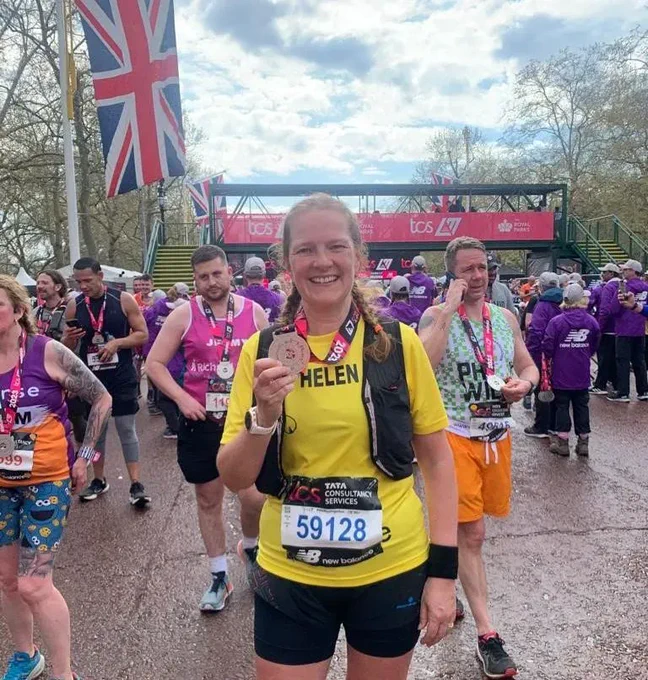 Helen London Marathon Runner for Help and Care 2023 showing her medal