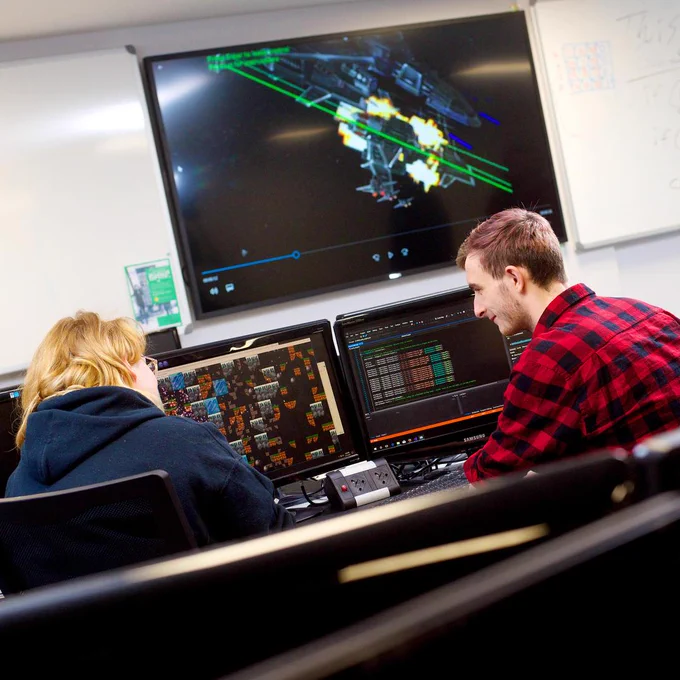 Computing students working on a project