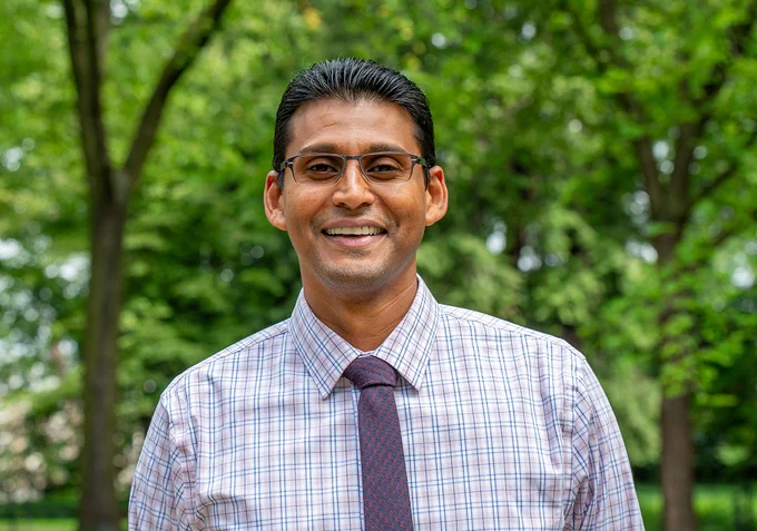 Vikash Gayah smiles and poses for portrait photo