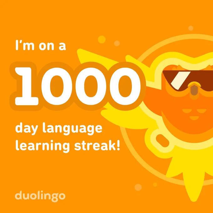 A badge marking a 1000 Day Language Streak on Duolingo, showing the Duolingo owl, Duo, on fire