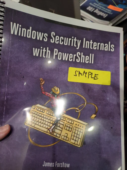 Sample copy of my next book, Windows Security Internals with PowerShell. The cover is purple with a picture of a cowboy riding a keyboard.