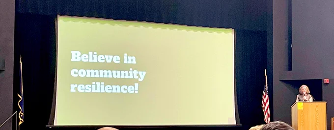 Superintendent Bonesteel presents a slide “ Believe in community resilience!”