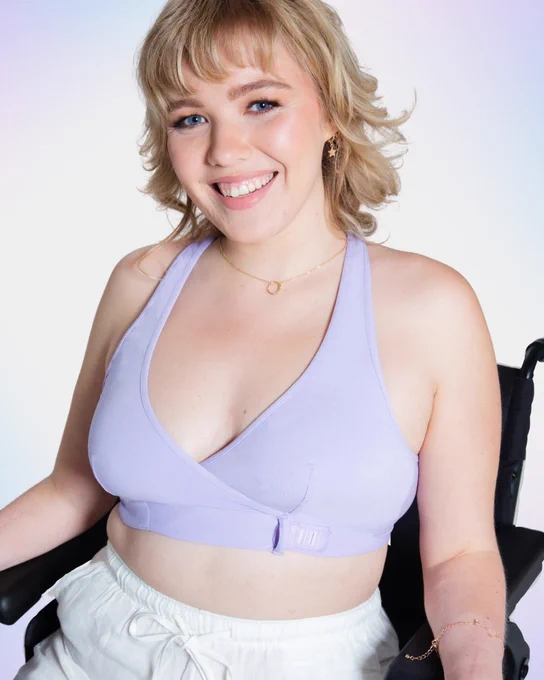 Slide 3: Model sitting in her wheelchair is wearing the new lilac Wrap Bralette.