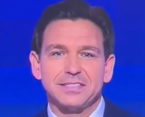 Ron DeSantis attempting to smile like a human.