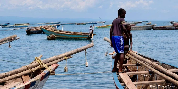 Boys on a fishing boat on the shores of Lake Tanganyika. 