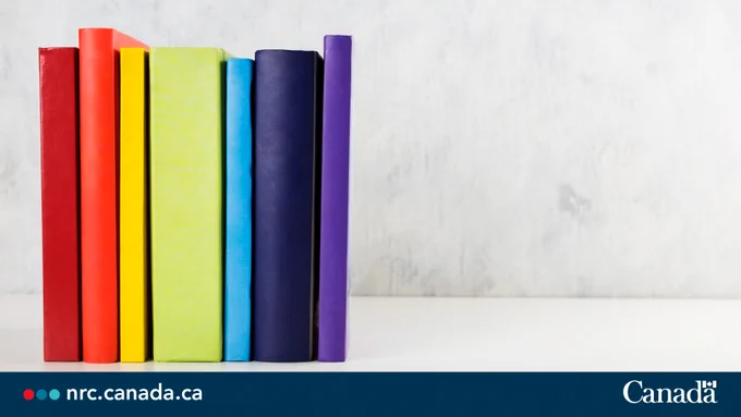 Stack of colorful rainbow books on white background. Text reads: nrc.canada.ca