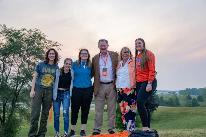 BGSU President and Dr. Earle stand with students at sunrise