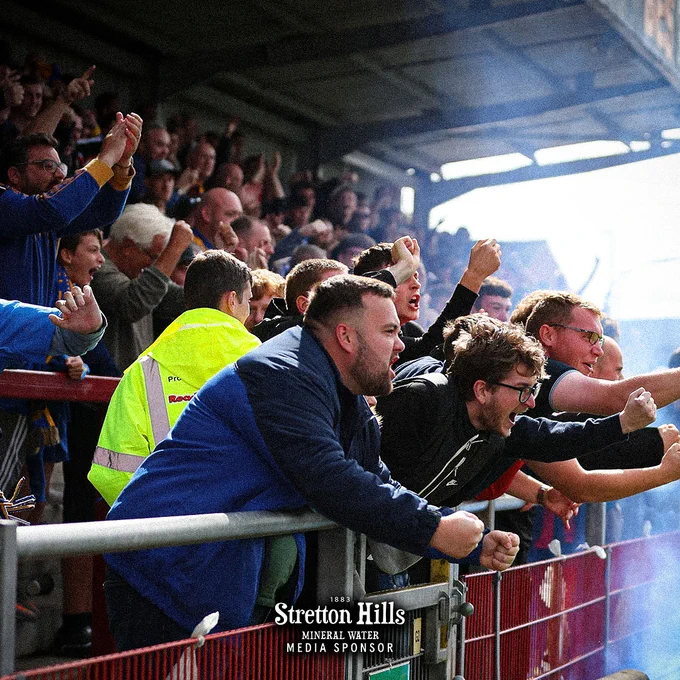 Shrewsbury Town fans celebrate Dan Udoh's goal.