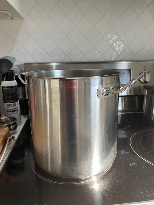 A large stock pot simmering on the stove