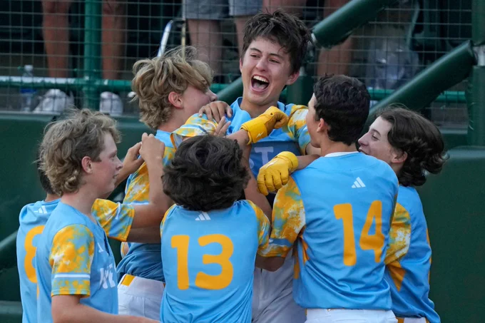 El Segundo, Calif.'s Louis Lappe, center, celebrates with teammates after hitting a solo walk-off home run off during the sixth inning of the Little League World Series Championship game.