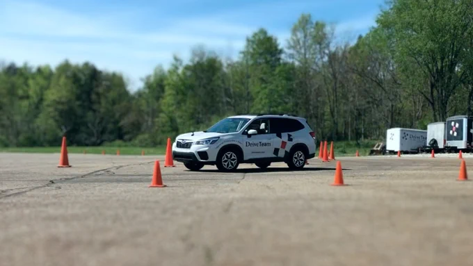 Photo of our DriveTeam car emphasizing the importance of mastering safe driving, not only for vehicle operation but also for understanding and applying road safety protocols, with a warning about the risks of neglect, including increased insurance costs and endangering lives.
