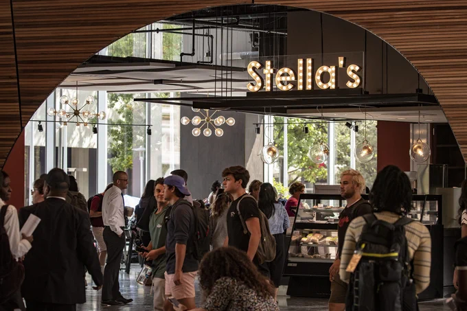 people standing in front of Stella's 