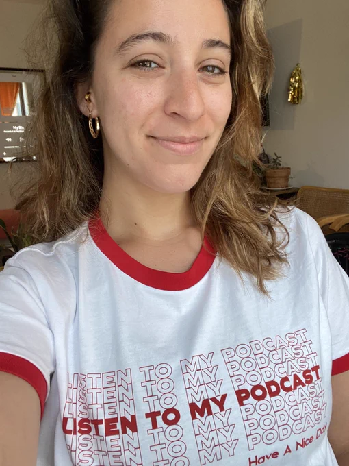 Selfie image of me wearing a T-shirt that says listen to my podcast and then at the end of the shirt says have a nice day.