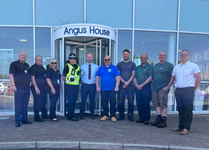 Angus Trusted Trader Members stood outside of Angus House with Police Scotland and Angus Council Councillor, Mark McDonald.