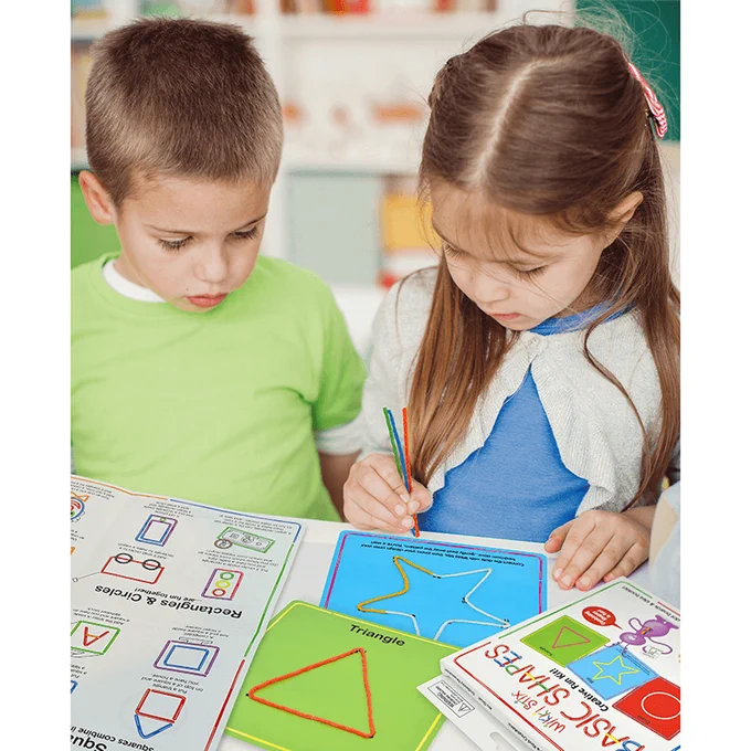 Girl and boy using the Wikki Stix Basic Shapes Kit to learn.