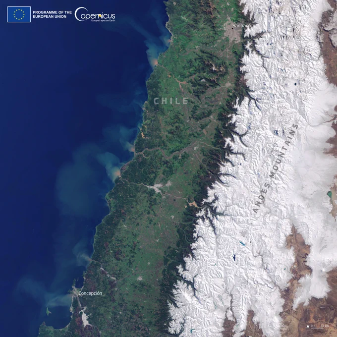 Satellite image of the Andes Mountains covered with snow and the cities of Santiago and Concepción nearby.