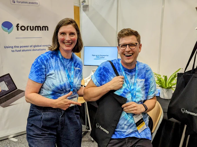 Dan and Hilary with bags at the Forumm booth