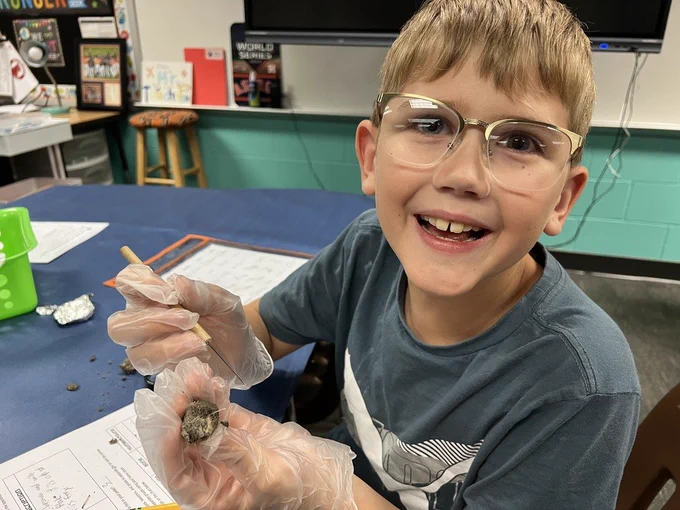 WCE 5th Grade students dissecting Owl Pellets